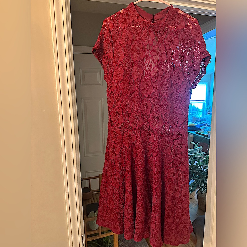 Maroon color knee length dress with a back cut out